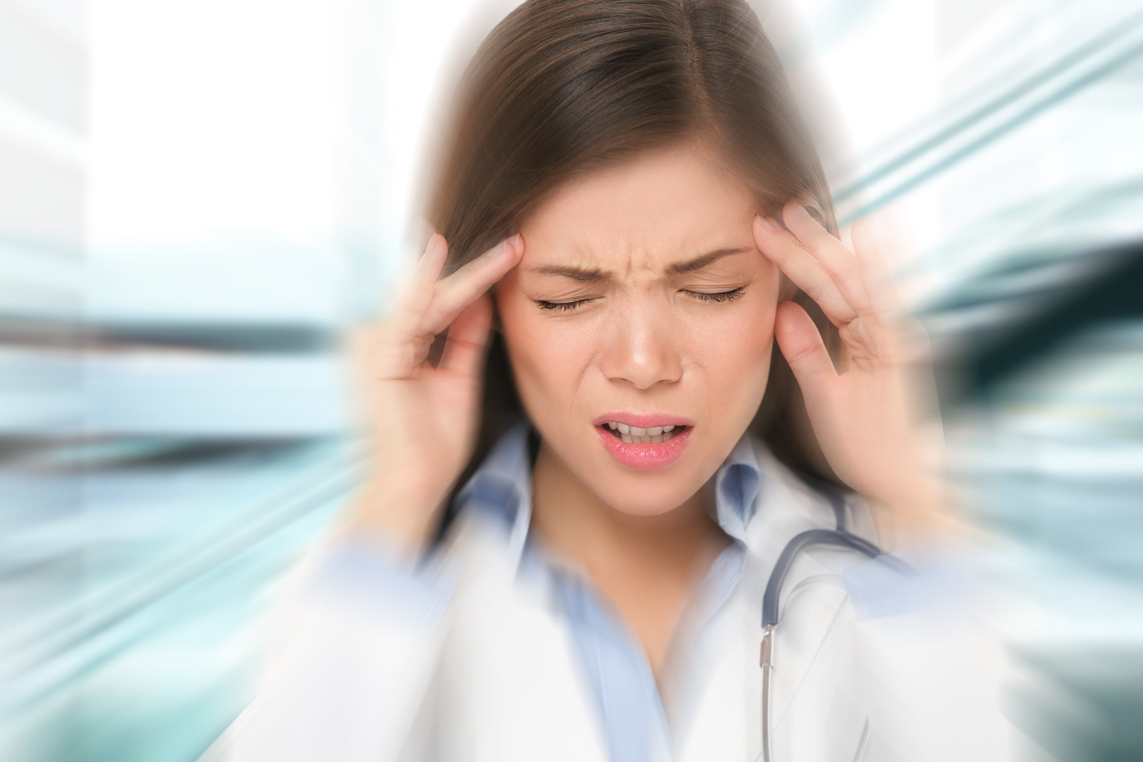 Woman with headache where Chinese TuiNa can help